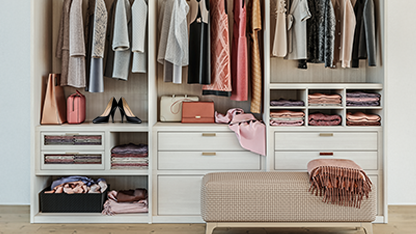 Wardrobe with clothing, footwear, fashion accessories, next to a bench