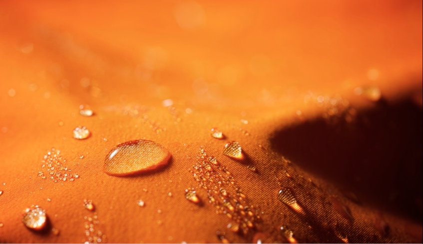 Close-up of the fabric of a waterproof mountain jacket.