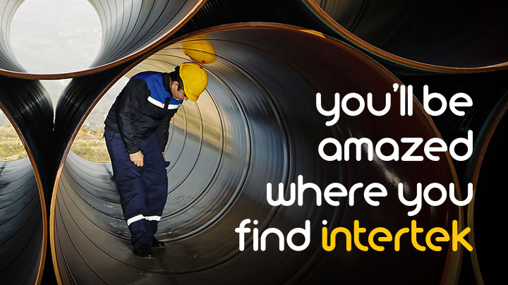 Man performing inspection inside large pipe