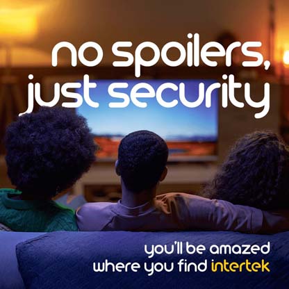 Group of people sitting on a couch watching television